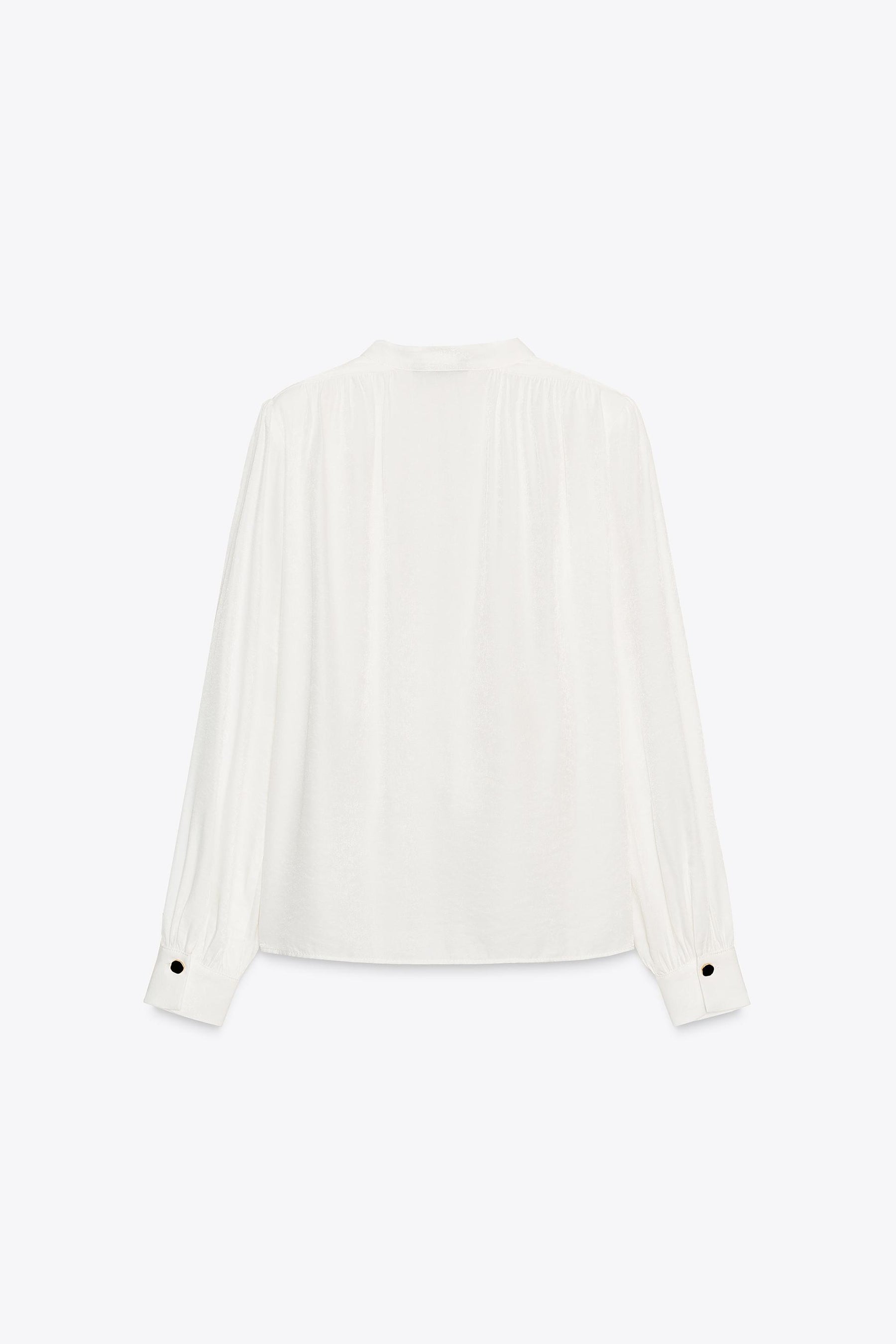 Shirt with shoulder pads