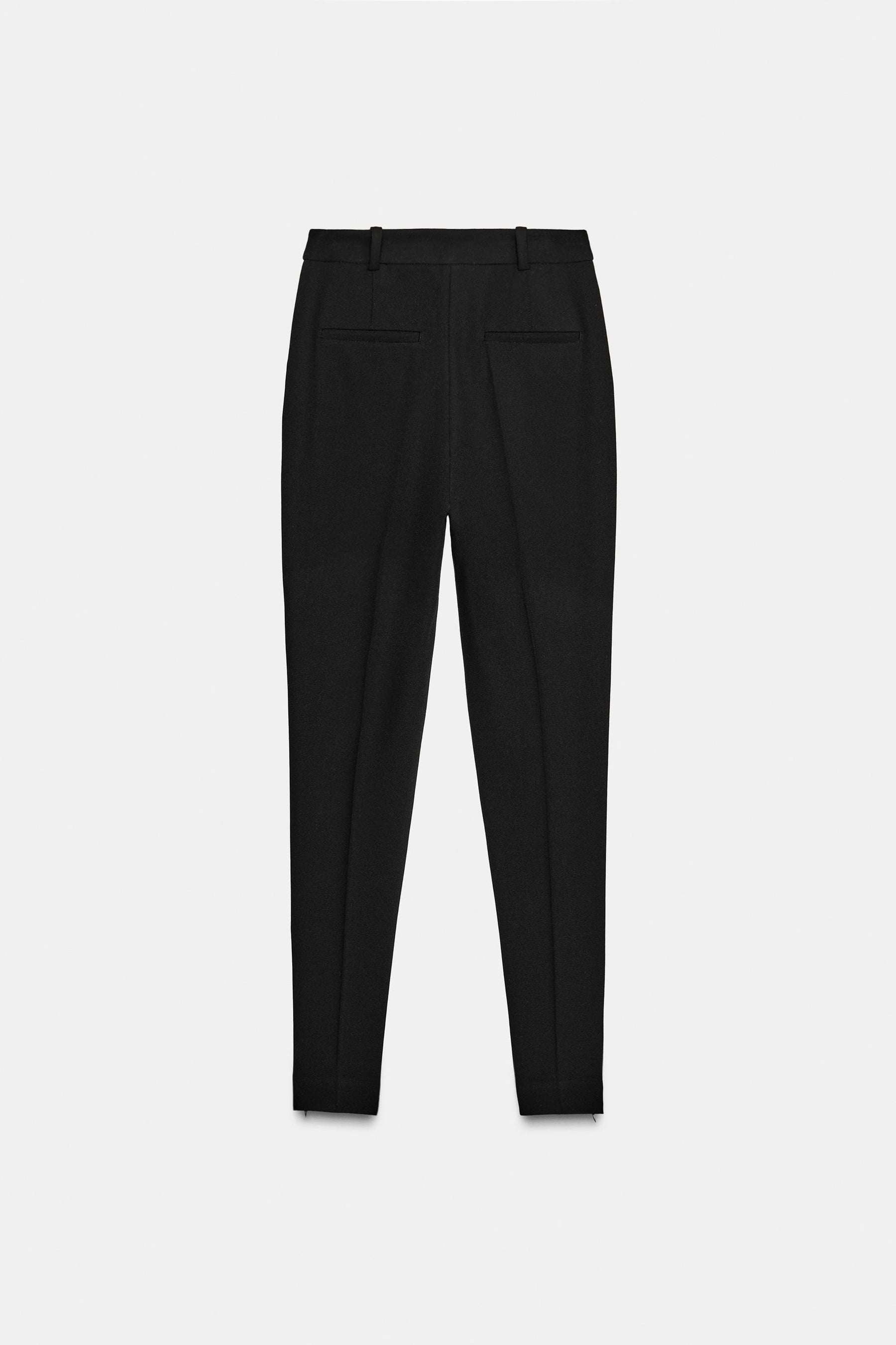 Slim-fit trousers with zipped