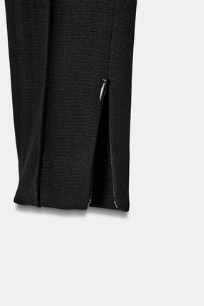 Slim-fit trousers with zipped