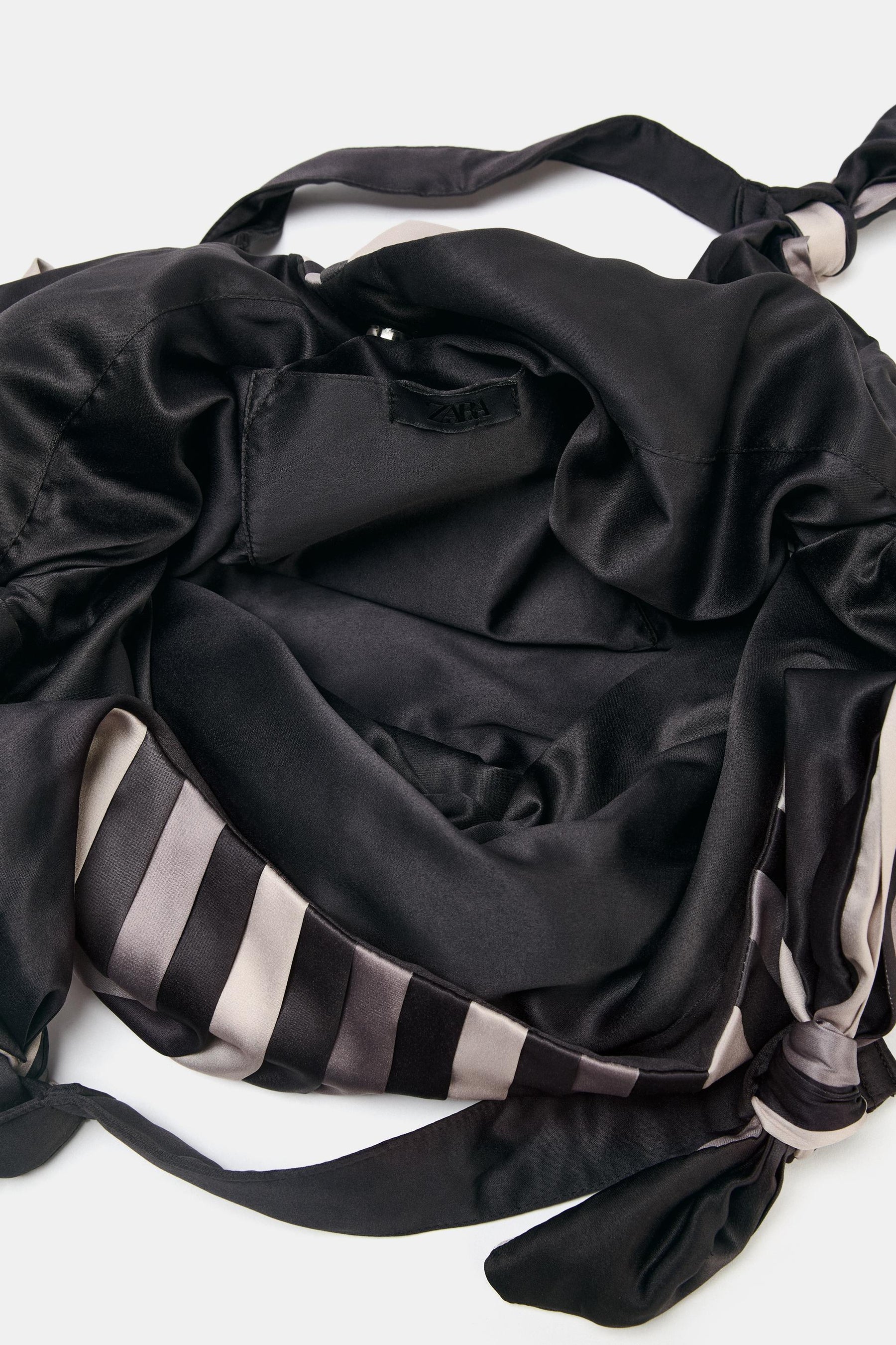 Satin-effect maxi bucket bag.