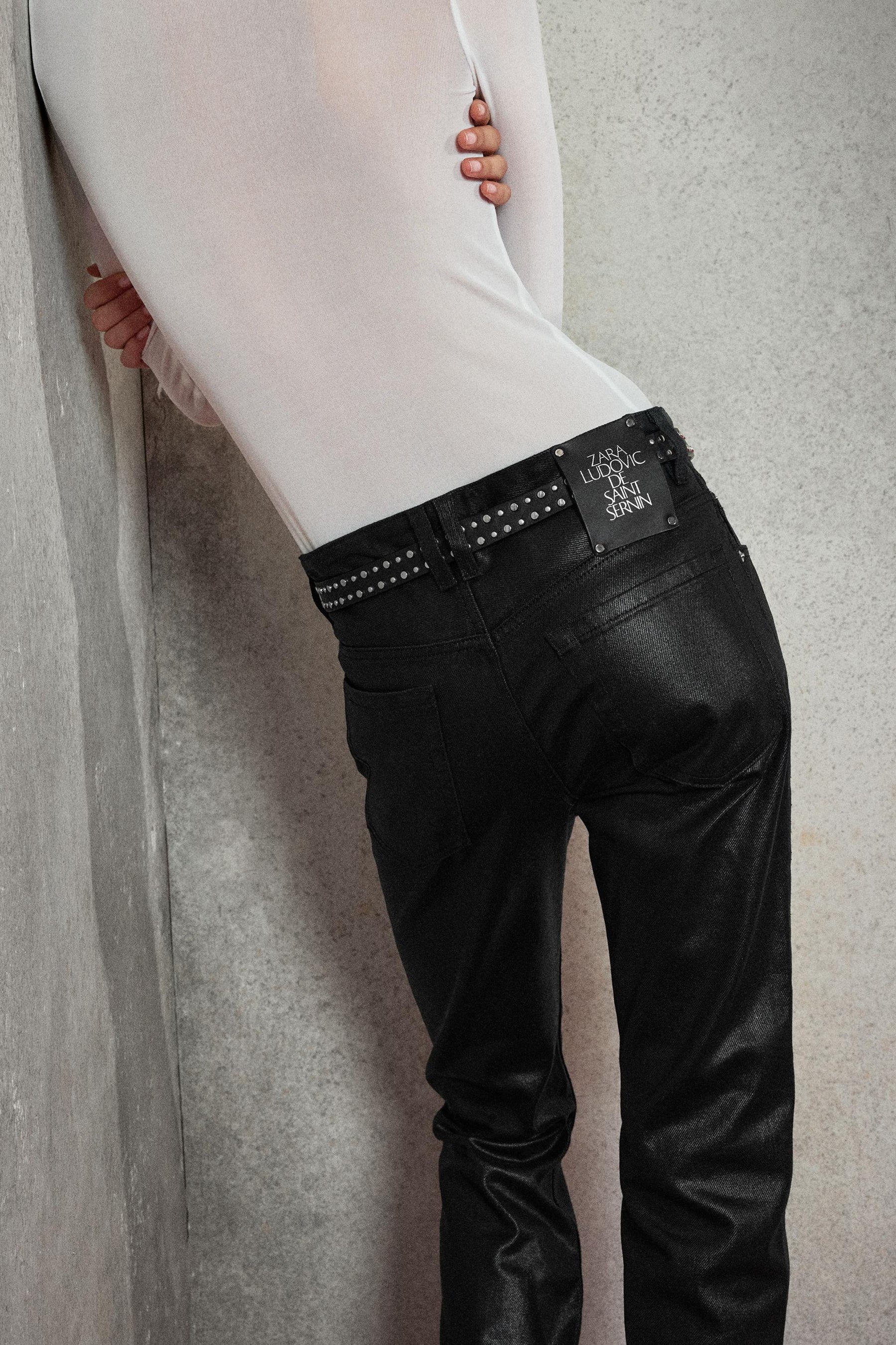 Waxed low-rise bootcut jeans